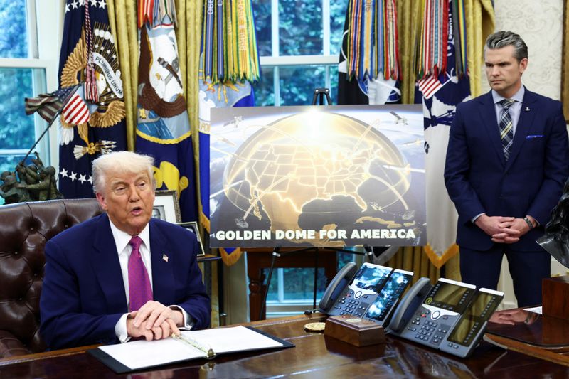 U.S. President Donald Trump makes an announcement regarding the Golden Dome missile defense shield next to U.S. Defense Secretary Pete Hegseth in the Oval Office of the White House in Washington, D.C., U.S., May 20, 2025. REUTERS/Kevin Lamarque