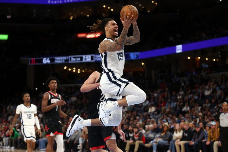 Jan 9, 2025; Memphis, Tennessee, USA; Memphis Grizzlies forward Brandon Clarke (15) drives to the basket during the second quarter against the Houston Rockets at FedExForum. Mandatory Credit: Petre Thomas-Imagn Images