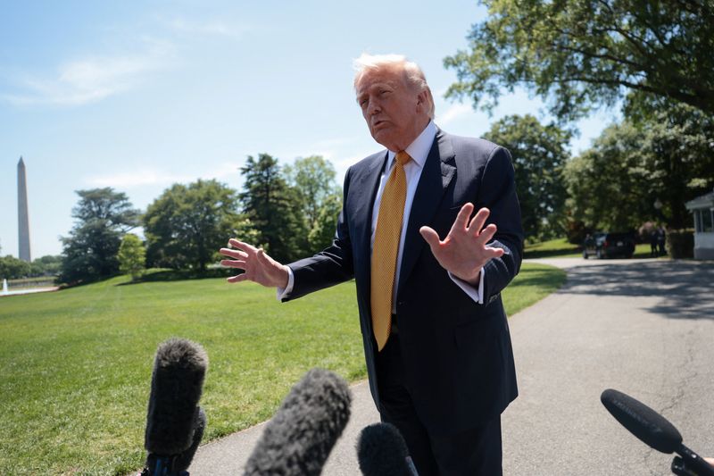 U.S. President Donald Trump speaks to the press, ahead of departing the White House for Joint Base Andrews en route to Beijing, China, in Washington, D.C., U.S., May 12, 2026. REUTERS/Evelyn Hockstein