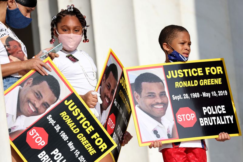 Family members of Ronald Greene listen to speakers as they gather at the Lincoln Memorial during the 'Get Your Knee Off Our Necks' march in support of racial justice in Washington, U.S., August 28, 2020. Michael M. Santiago/Pool via REUTERS/File Photo