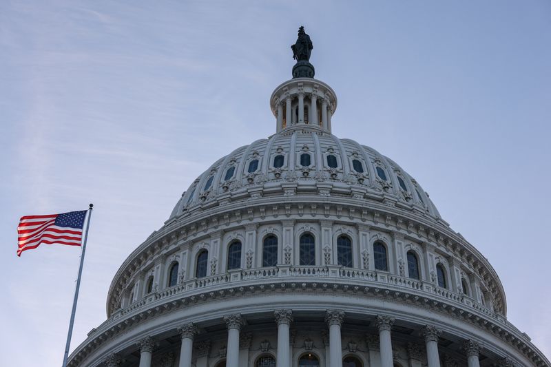An American flag flies outside the U.S. Capitol building at sunset, as members of Congress work to resolve a dispute over immigration enforcement and avert a looming partial government shutdown, on Capitol Hill in Washington, D.C., U.S., January 30, 2026. REUTERS/Kylie Cooper