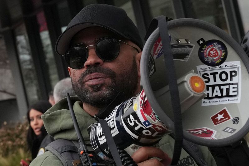Former national chairman of the Proud Boys, Enrique Tarrio, holds a megaphone following a march from The Ellipse to the U.S. Capitol in memory of those who died on, or in the aftermath, of the January 6, 2021 attack on the U.S. Capitol, on the fifth anniversary of the attack in Washington, D.C., U.S., January 6, 2026. REUTERS/Leah Millis