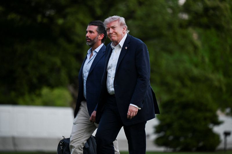 U.S. President Donald Trump and his son Donald Trump Jr. arrive at the White House in Washington, D.C., U.S., May 3, 2026. REUTERS/Annabelle Gordon