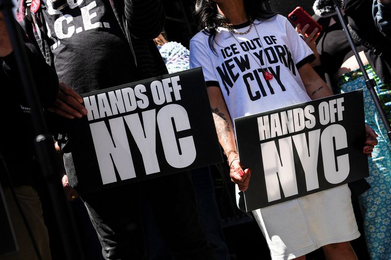 Demonstrators hold signs during an anti-ICE protest in front of 26 Federal Plaza Immigration Court in the Manhattan borough of New York City, U.S. May 12, 2026. REUTERS/Ryan Murphy/File Photo