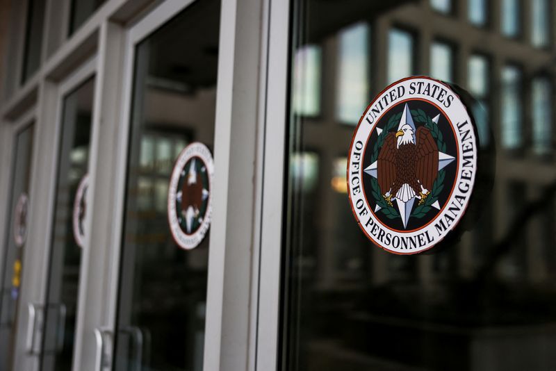 A view shows logos of the Office of Personnel Management (OPM), after probationary staff at the OPM were fired in a conference call and given less than an hour to leave the building, outside OPM in Washington, D.C., U.S., February 13, 2025. REUTERS/Tierney L. Cross