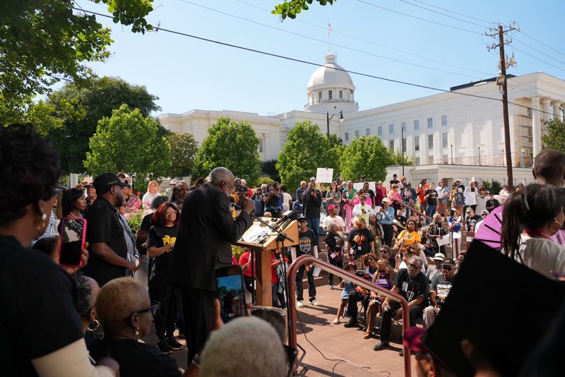 FILE PHOTO: A speaker addresses protesters at a rally over voting rights and redistricting outside the state capitol in Montgomery, Alabama, U.S. May 4, 2026.  REUTERS/Jayla Whitfield-Anderson/File Photo