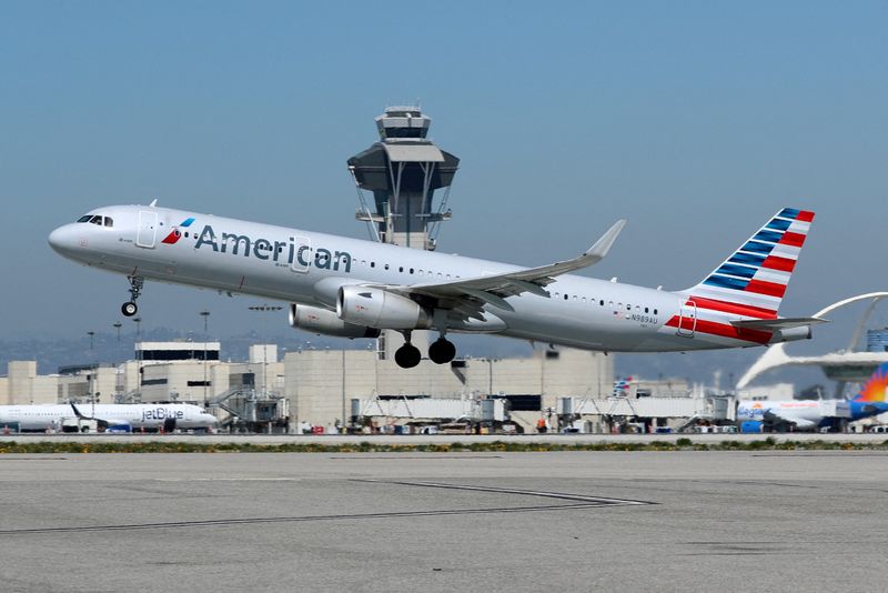 FILE PHOTO: An American Airlines Airbus A321-200 plane takes off from Los Angeles International airport (LAX) in Los Angeles, California, U.S. March 28, 2018. REUTERS/Mike Blake/File Photo