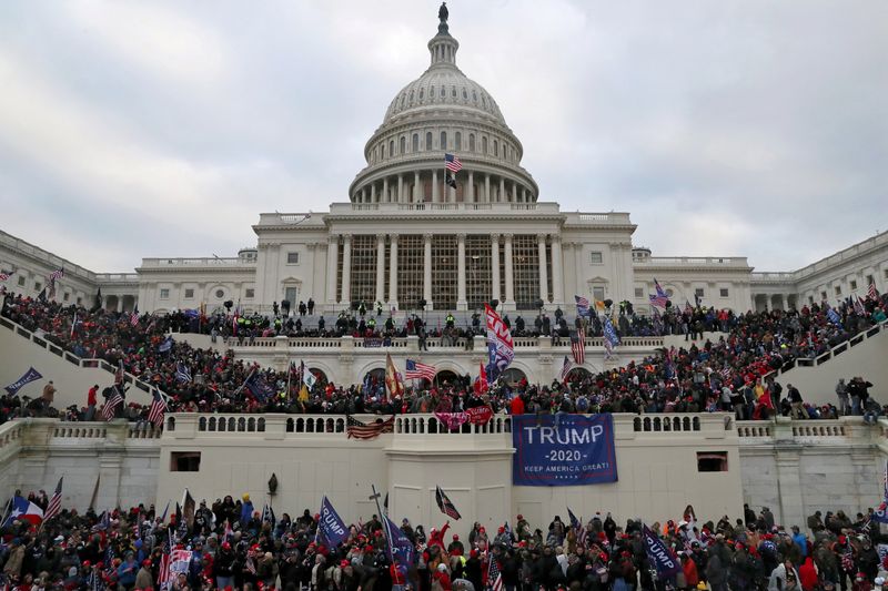 A mob of supporters of U.S. President Donald Trump storm the U.S. Capitol Building in Washington, U.S., January 6, 2021. Picture taken January 6, 2021. REUTERS/Leah Millis