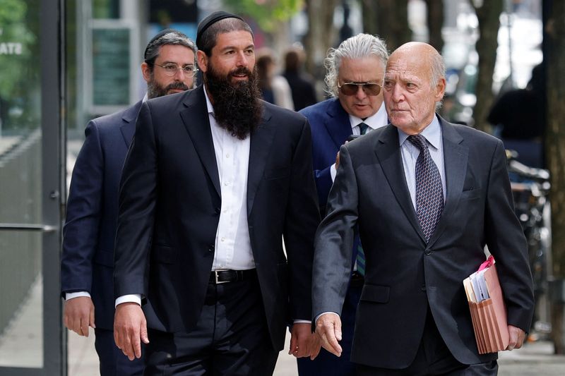Lorenzo Nourafchan and Nicolo Nourafchan arrive to the federal courthouse, where they are facing charges with participating in an insider trading scheme in which attorneys at major law firms passed tips on merger deals to a network of individuals who traded on the information, in Boston, Massachusetts, U.S., June 1, 2026.   REUTERS/CJ Gunther