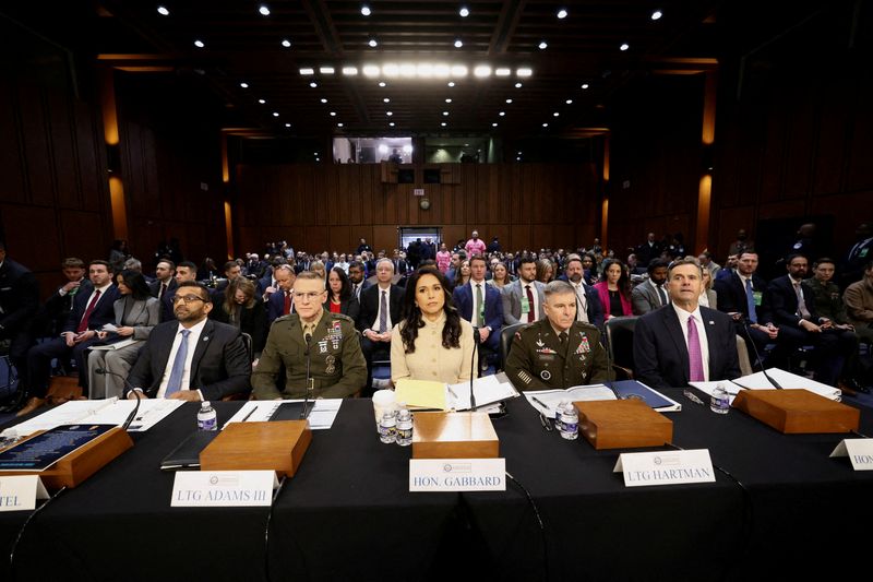 FILE PHOTO: FBI Director Kash Patel, Defense Intelligence Agency Director Lt. Gen. James Adams, Director of National Intelligence (DNI) Tulsi Gabbard, Acting National Security Agency Director Lt. Gen. William Hartman and CIA Director John Ratcliffe testify before a Senate Intelligence Committee hearing on Capitol Hill in Washington, D.C., U.S., March 18, 2026.  REUTERS/Kevin Lamarque/File Photo