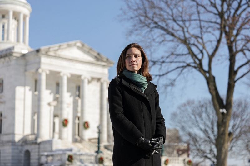 Rebecca Bennett, a former U.S. Navy helicopter pilot who is running to represent New Jersey’s 7th Congressional District, poses for a photograph in Somerville, New Jersey, U.S., December 16, 2025. REUTERS/Jeenah Moon