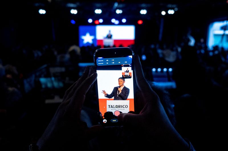 A person used a mobile phone to take visuals of Democratic Senate candidate James Talarico speaking during a rally in San Antonio, Texas, U.S., May 29, 2026.   REUTERS/Joel Angel Juarez