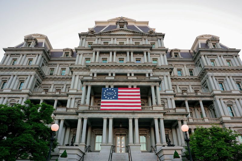 FILE PHOTO: An America250 flag decorates the Eisenhower Executive Office Building, which U.S. President Donald Trump's administration has proposed to paint white, in Washington, D.C., U.S., May 7, 2026. REUTERS/Kylie Cooper/File Photo
