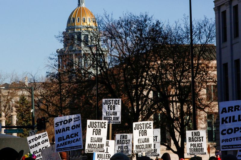 FILE PHOTO: Protesters march to call for justice for Elijah McClain after Governor Jared Polis amended his executive order regarding the investigation of McClain's death, which has raised concerns that charges against the police officers involved may ultimately be watered down, in Denver, Colorado, U.S., November 21, 2020.  REUTERS/Kevin Mohatt/File Photo