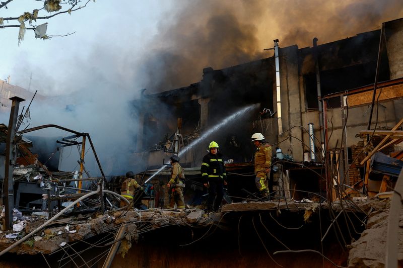 FILE PHOTO: Firefighters work at the site of a car repair workshop damaged during Russian missile and drone strikes, amid Russia's attack on Ukraine, in Kyiv, Ukraine June 2, 2026. REUTERS/Valentyn Ogirenko/File Photo