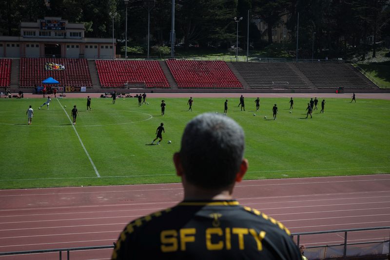 A fan watches a game between FC Davis and San Francisco City FC at the Kezar Stadium in San Francisco, California, U.S., May 17, 2026. REUTERS/Carlos Barria