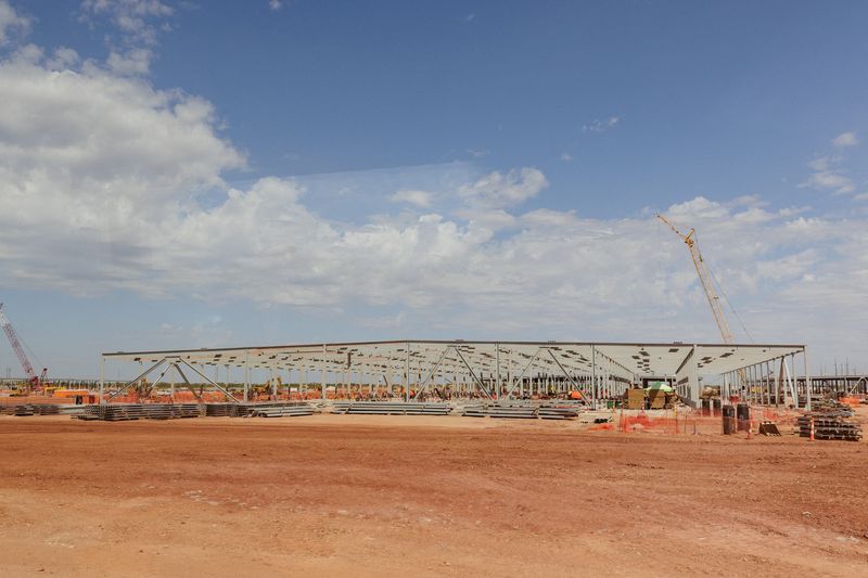 FILE PHOTO: The steel frame of data centers under construction during a tour of the OpenAI data center in Abilene, Texas, U.S., September 23, 2025. A total of eight data center buildings are planned to exist on the campus.  REUTERS/Shelby Tauber/Pool/File Photo