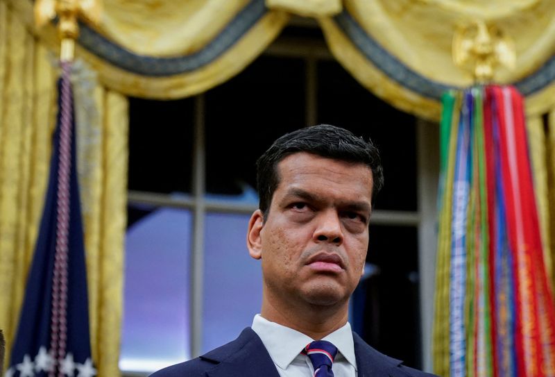Sriram Krishnan, Senior White House Policy Advisor on Artificial Intelligence, listens prior to U.S. President Donald Trump (not pictured) signing an executive order on AI in the Oval Office at the White House in Washington, D.C., U.S. December 11, 2025. REUTERS/Al Drago