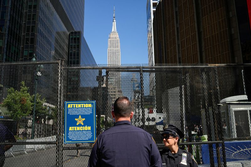 New York Police Department officers stand guard next to a security fence outside of Madison Square Garden ahead of Game three of the NBA Finals between the New York Knicks and San Antonio Spurs at Madison Square Garden in New York City, U.S., June 8, 2026.  REUTERS/Eduardo Munoz