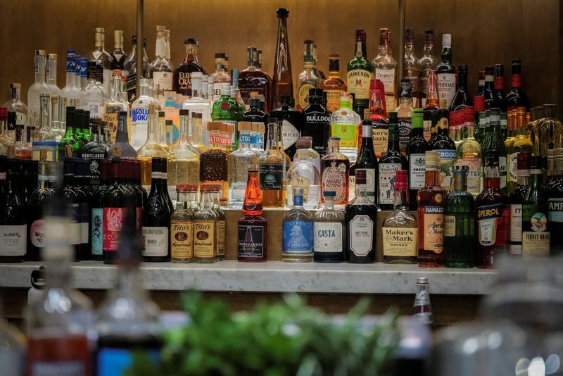 Liquors are displayed at a bar in New York City, U.S., April 9, 2025. REUTERS/Jeenah Moon