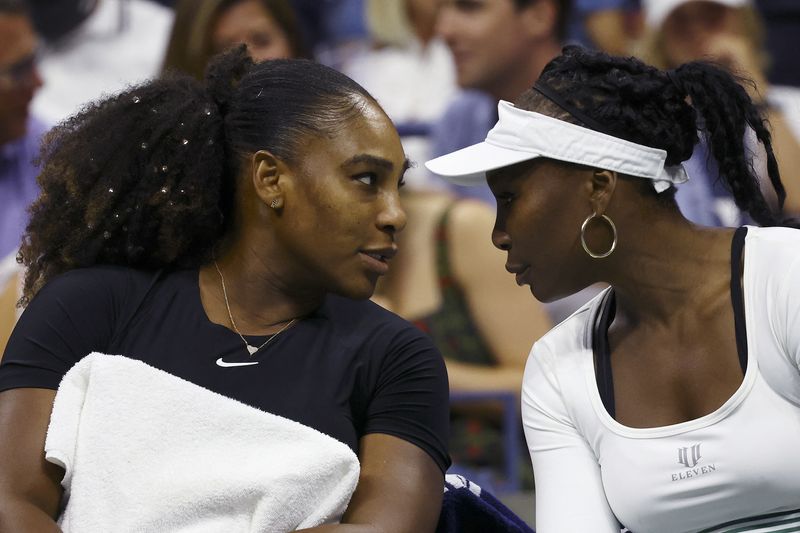 FILE PHOTO: Tennis - U.S. Open - Flushing Meadows, New York, United States - September 1, 2022  Venus Williams and Serena Williams of the U.S. during their women's doubles first round match against Czech Republic's Linda Fruhvirtova and Lucie Hradecka REUTERS/Mike Segar/File Photo