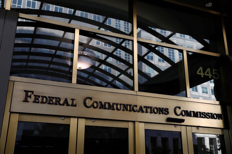 FILE PHOTO: Signage is seen at the headquarters of the Federal Communications Commission in Washington, D.C., U.S., August 29, 2020. REUTERS/Andrew Kelly/File Photo