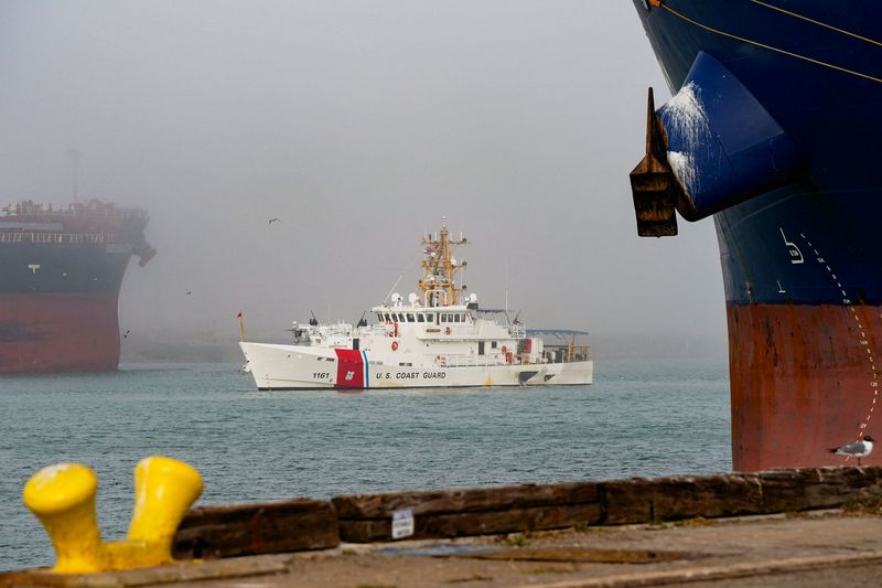 FILE PHOTO: A U.S. Coast Guard boat sails as U.S. President Donald Trump delivers remarks during an event at the Port of Corpus Christi in Corpus Christi, Texas, U.S., February 27, 2026. REUTERS/Elizabeth Frantz/File Photo