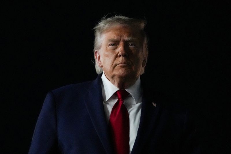 U.S. President Donald Trump looks on, as he returns after attending Game 3 of the NBA Finals, at John F. Kennedy International Airport in New York, U.S., June 8, 2026. REUTERS/Nathan Howard