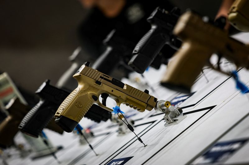 Pistols are displayed during the National Rifle Association annual meeting in Atlanta, Georgia, U.S. April 25, 2025. REUTERS/Jeenah Moon