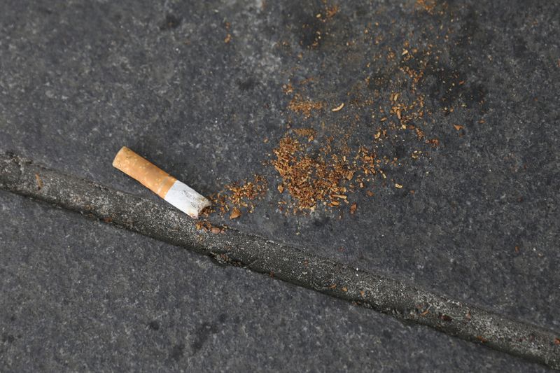 FILE PHOTO: A cigarette butt lies on a street in New York, U.S., May 10, 2017. REUTERS/Shannon Stapleton