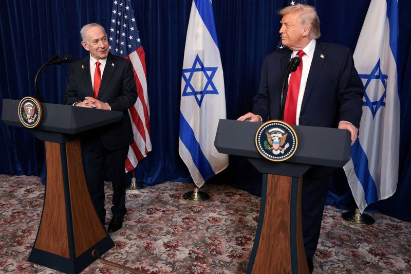 FILE PHOTO: U.S. President Donald Trump and Israeli Prime Minister Benjamin Netanyahu hold a press conference after meeting at Trump’s Mar-a-Lago club in Palm Beach, Florida, U.S., December 29, 2025. REUTERS/Jonathan Ernst/File Photo