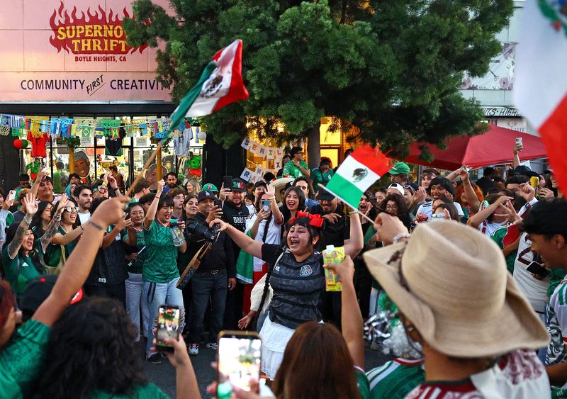 Supporters of Mexico celebrate after Mexico won the FIFA World Cup group stage match between Mexico and South Korea on the streets in Boyle Heights in Los Angeles, California, U.S., June 18, 2026. Despite being one of the biggest cities in the U.S., Los Angeles and southern California is home for millions of Mexican-born and Mexican-descended people and makes Mexico a home team for them. REUTERS/Lisi Niesner