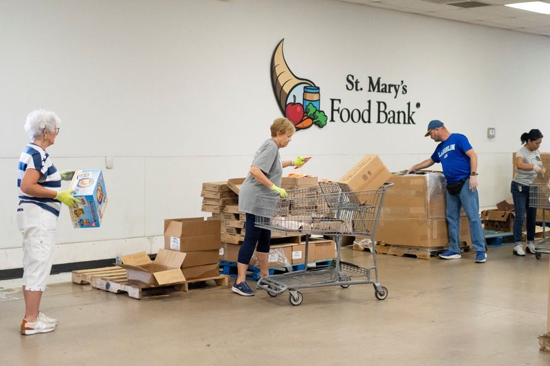 Volunteers assemble food boxes during a daily food distribution at St. Mary's Food Bank in Phoenix, U.S. May 29, 2026.  REUTERS/Rebecca Noble