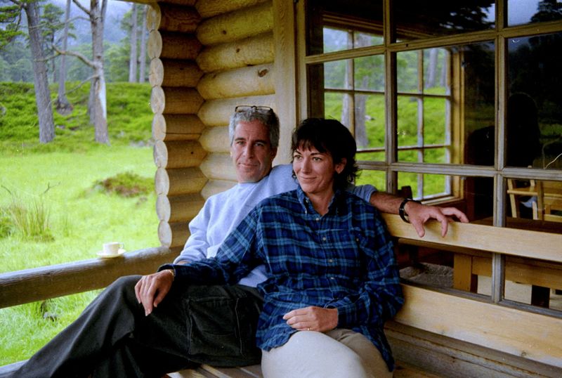 FILE PHOTO: Ghislaine Maxwell and Jeffrey Epstein are seen in this image released by the Department of Justice in Washington, D.C., U.S., on December 19, 2025 as part of a new trove of documents from its investigations into the late financier and convicted sex offender Jeffrey Epstein. U.S. Justice Department/Handout via REUTERS/File Photo
