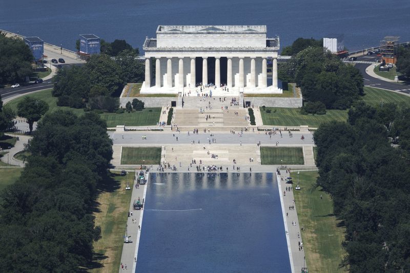 Visitors walk along the Reflecting Pool near the Lincoln Memorial on the National Mall in Washington, D.C., U.S., June 24, 2026. REUTERS/Tom Brenner