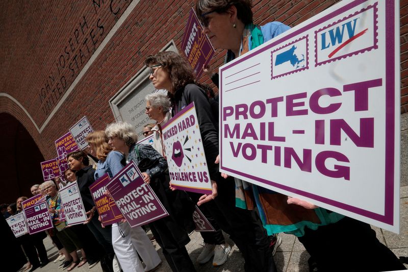 Supporters gather outside the federal courthouse after a hearing in a lawsuit brought by a coalition of Democratic state attorneys general seeking to block U.S. President Donald Trump's executive order tightening rules on mail-in voting, in Boston, Massachusetts, U.S., June 2, 2026.   REUTERS/Brian Snyder