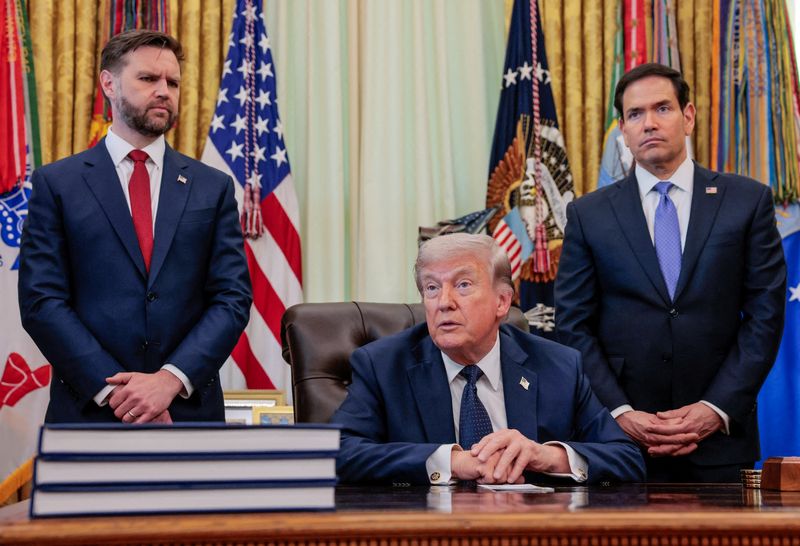 FILE PHOTO: U.S. President Donald Trump speaks in the Oval Office, with Vice President JD Vance and Secretary of State Marco Rubio standing behind him, at the White House in Washington, D.C., U.S., April 23, 2026. REUTERS/Kylie Cooper/File Photo