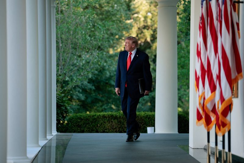 U.S. President Donald Trump walks to address guests as he hosts a dinner with farmers in the Rose Garden of the White House in Washington, D.C., U.S., June 25, 2026. REUTERS/Evan Vucci