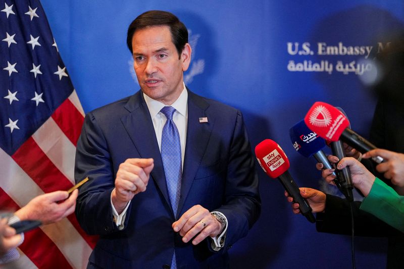 FILE PHOTO: U.S. Secretary of State Marco Rubio speaks with members of the media before departing for Bahrain International Airport after his visit to the Middle East to discuss the interim deal between the U.S. and Iran with Arab Gulf allies, in Manama, Bahrain, June 25, 2026. REUTERS/Eric Lee/Pool/File Photo