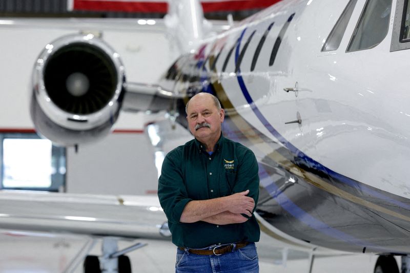 FILE PHOTO: Pilot Terry Alberta poses for a portrait at the West Michigan Regional Airport, in Holland, Michigan, U.S., May 9, 2025. REUTERS/Kristen Norman/File Photo