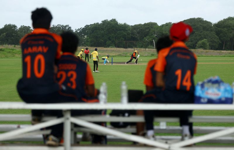 Players from the Atlanta team watch from the bleachers during their match against Houston at a youth cricket tournament at the Prairie View Cricket Complex near Houston, Texas, U.S., June 24, 2026 REUTERS/Phil Noble