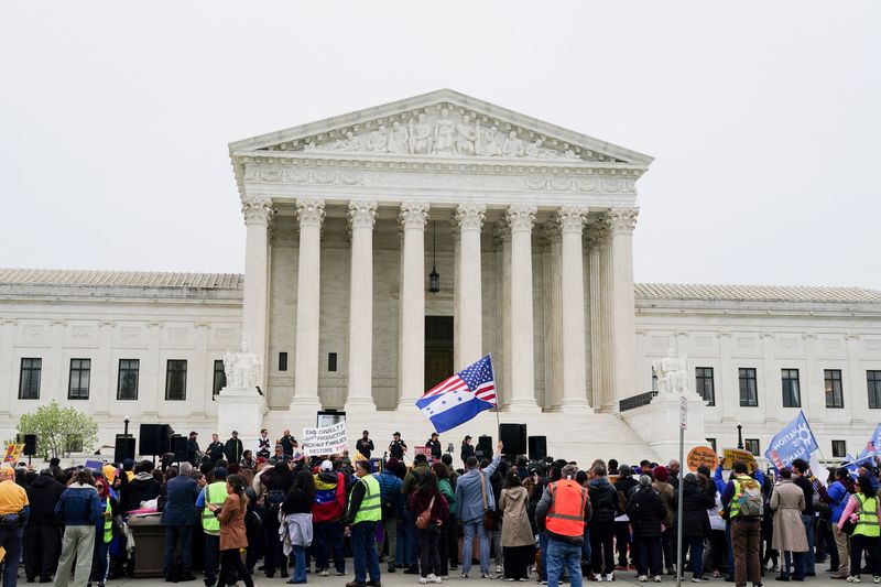 Immigrants' rights activists and demonstrators attend a rally outside the U.S. Supreme Court, as justices were scheduled to hear arguments on whether the administration of U.S. President Donald Trump can end the Temporary Protected Status (TPS) of Syrian and Haitian nationals, in Washington, D.C., U.S., April 29, 2026. REUTERS/Nathan Howard