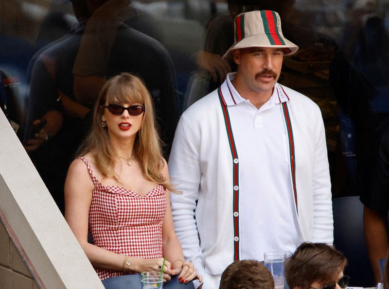 FILE PHOTO: Tennis - U.S. Open - Flushing Meadows, New York, United States - September 8, 2024 Singer Taylor Swift and Kansas City Chiefs' Travis Kelce are seen during the final match between Italy's Jannik Sinner and Taylor Fritz of the U.S. REUTERS/Eduardo Munoz/File Photo