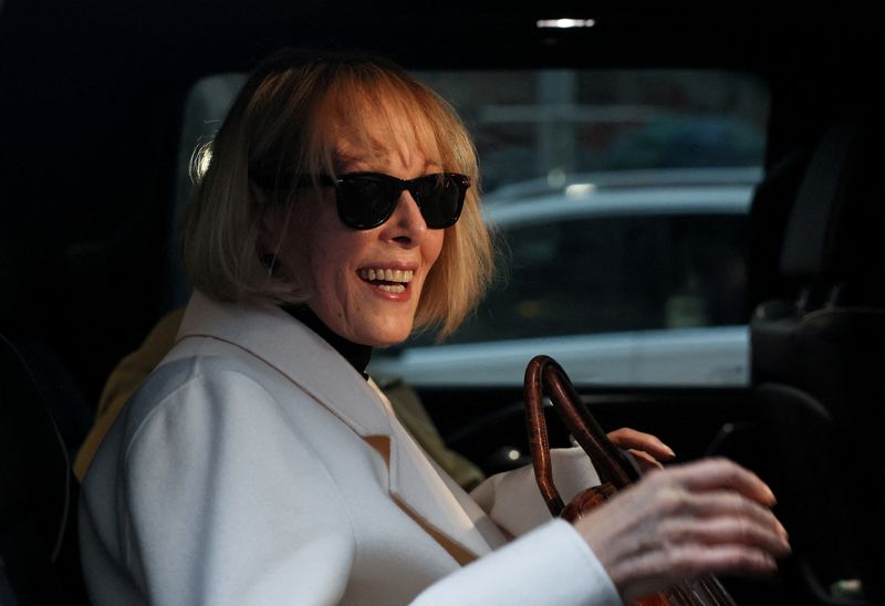 FILE PHOTO: E. Jean Carroll reacts in a car outside the Manhattan Federal Court, after the verdict in the second civil trial was reached after she accused former U.S. President Donald Trump of raping her decades ago, in New York City, U.S., January 26, 2024. REUTERS/Brendan Mcdermid/File Photo