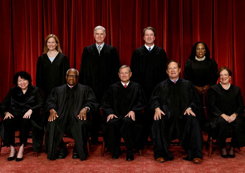 FILE PHOTO: U.S. Supreme Court justices pose for their group portrait at the Supreme Court in Washington, U.S., October 7, 2022. Seated (L-R): Justices Sonia Sotomayor, Clarence Thomas, Chief Justice John G. Roberts, Jr., Samuel A. Alito, Jr. and Elena Kagan. Standing (L-R): Justices Amy Coney Barrett, Neil M. Gorsuch, Brett M. Kavanaugh and Ketanji Brown Jackson. REUTERS/Evelyn Hockstein/File Photo