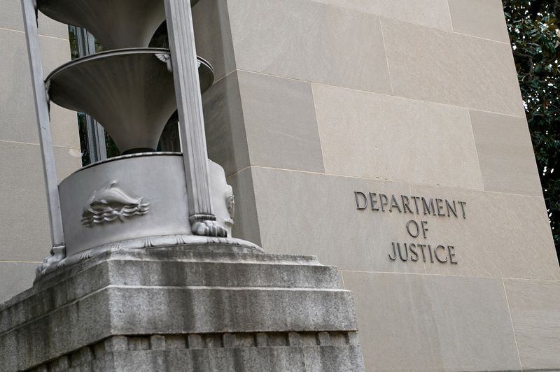 A sign on the wall of the U.S. Department of Justice building in Washington, D.C., U.S., November 14, 2025. REUTERS/Elizabeth Frantz