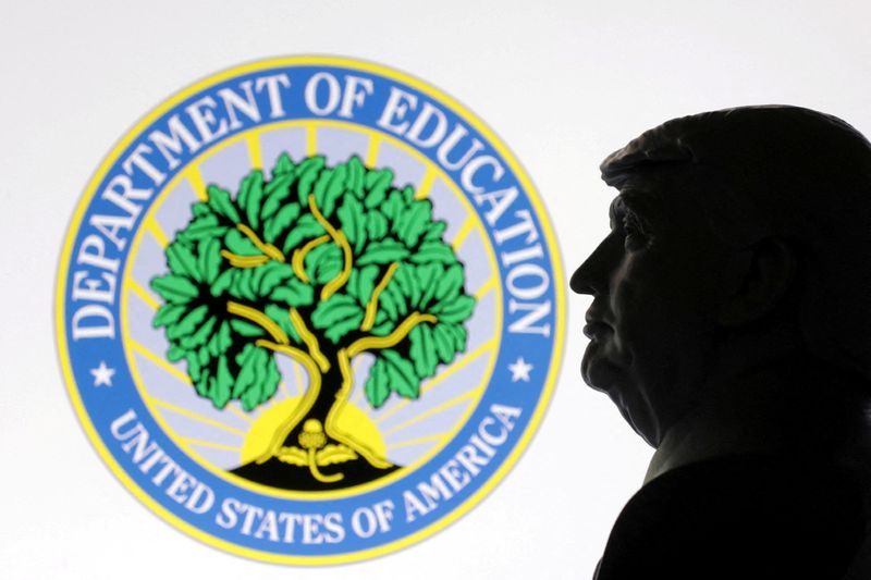 FILE PHOTO: A 3D-printed miniature model of U.S. President Donald Trump with the U.S. Department of Education logo in the background is seen in this illustration taken April 23, 2025. REUTERS/Dado Ruvic/Illustration/File Photo
