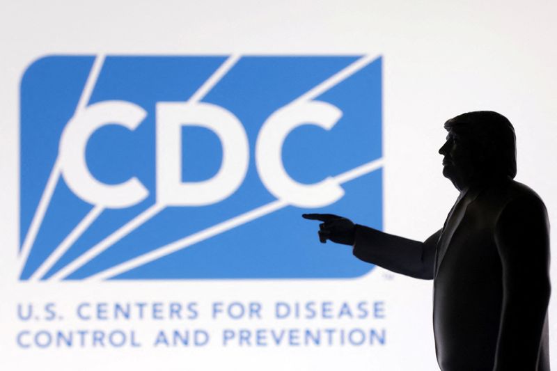 FILE PHOTO: A 3D-printed miniature model of U.S. President Donald Trump with the U.S. Centers for Disease Control (CDC) logo in the background is seen in this illustration taken April 23, 2025. REUTERS/Dado Ruvic/Illustration/ File Photo