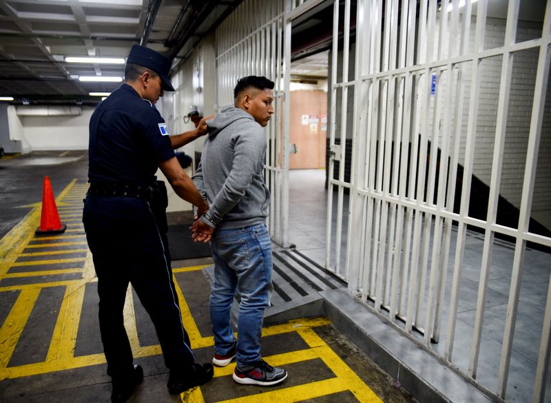Migrant smuggler Oswaldo Manuel Zavala Quino is seen after being detained in a joint operation between Guatemalan and U.S. authorities for his involvement in a deadly 2021 truck accident that killed 56 migrants in southern Mexico, following a court hearing at the Palace of Justice, in Guatemala City, Guatemala, December 9, 2024. REUTERS/ Cristina Chiquin