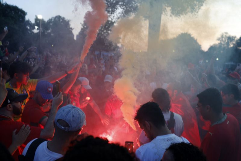 Soccer Football - FIFA World Cup 2026 - Quarter Final - France v Morocco - Fans gather in Boston, Massachusetts, U.S. - July 8, 2026 Morocco fans light flares as they gather on Boston Common ahead of their game against France REUTERS/Brian Snyder